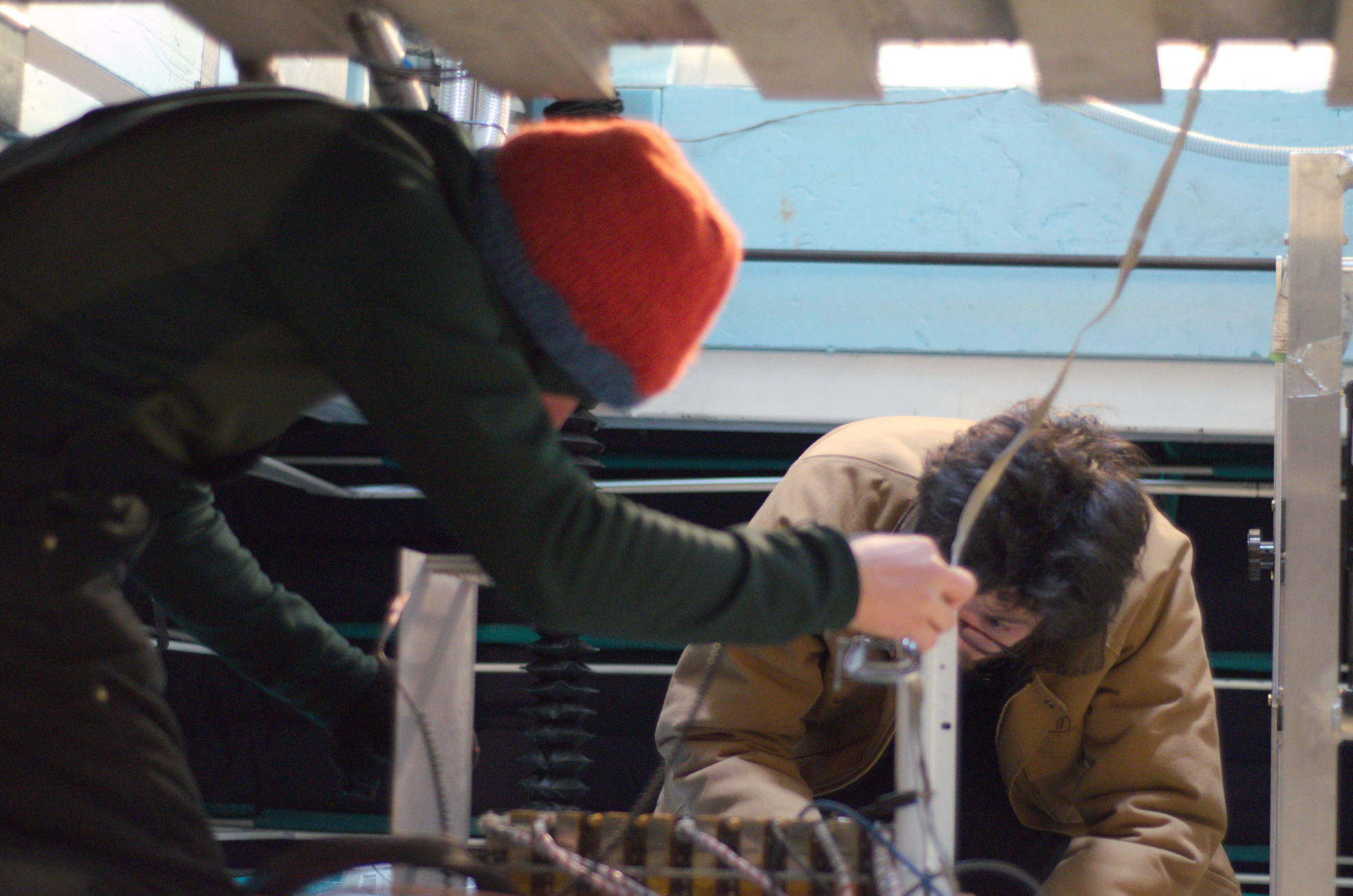 The winterovers (me and Andrew) working on test equipment underneath the receiver.
