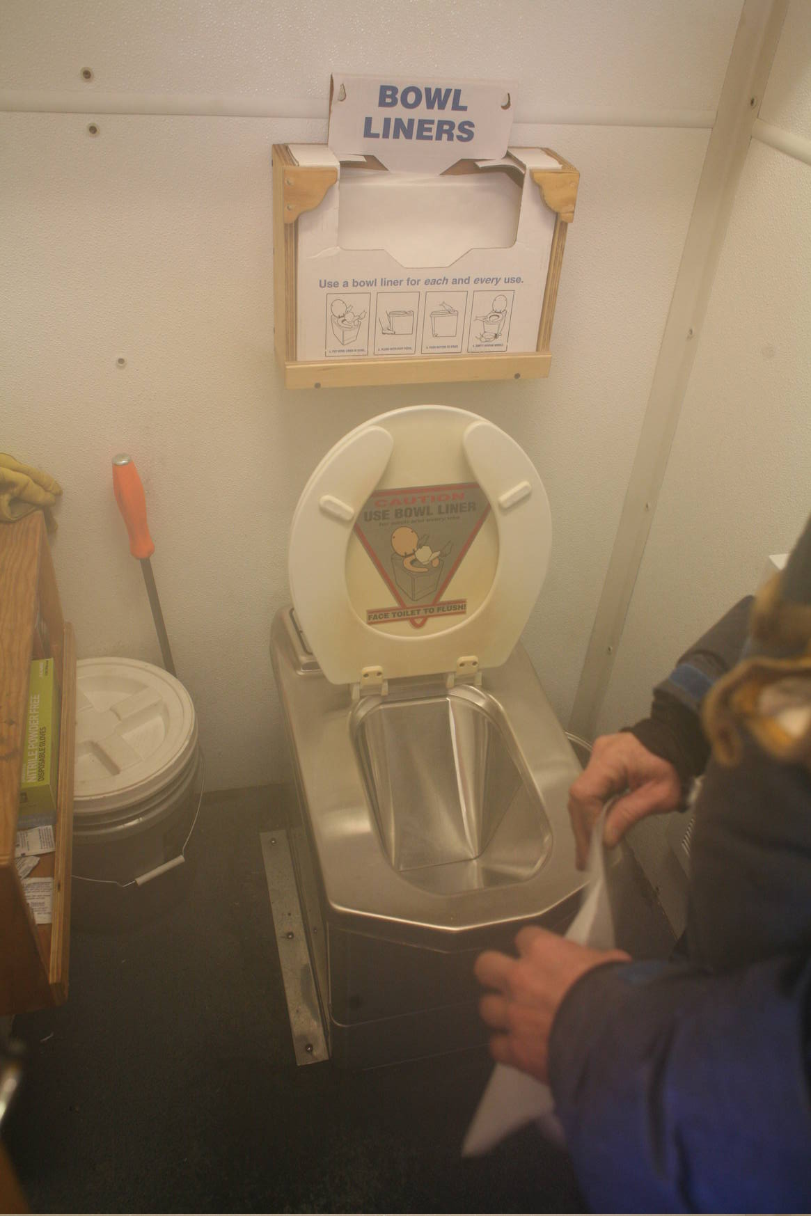 The traverse is equipped with kitchen, showers, and laundry machines. This picture shows an incinerator toilet that literally burns up human excrements in order to reduce waste.