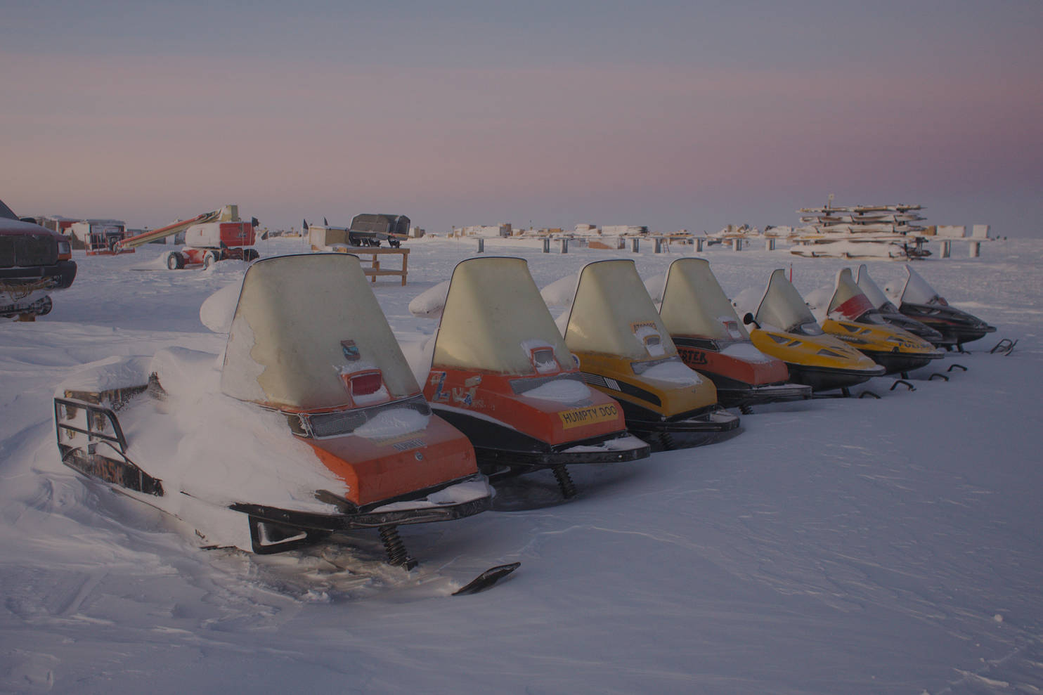 A row of snowmobiles.